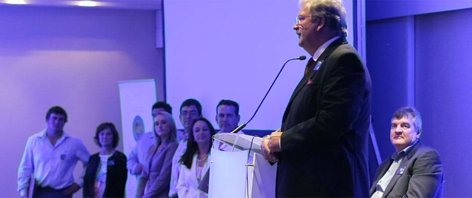 Mr Andries Theron congratulates researchers and producers on their achievements